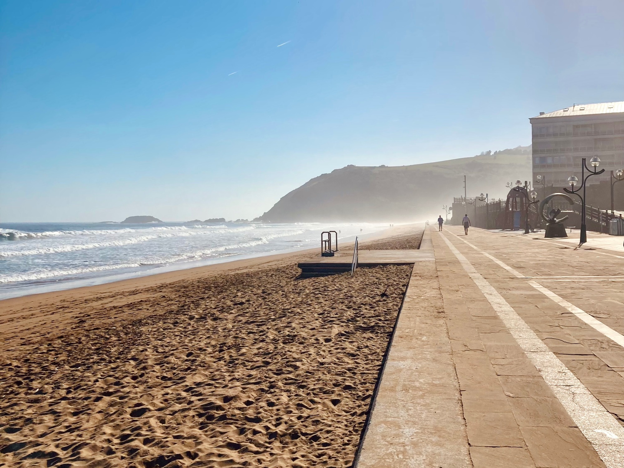 Beach of Zarautz with the open sea on the left and the city buildings on the right